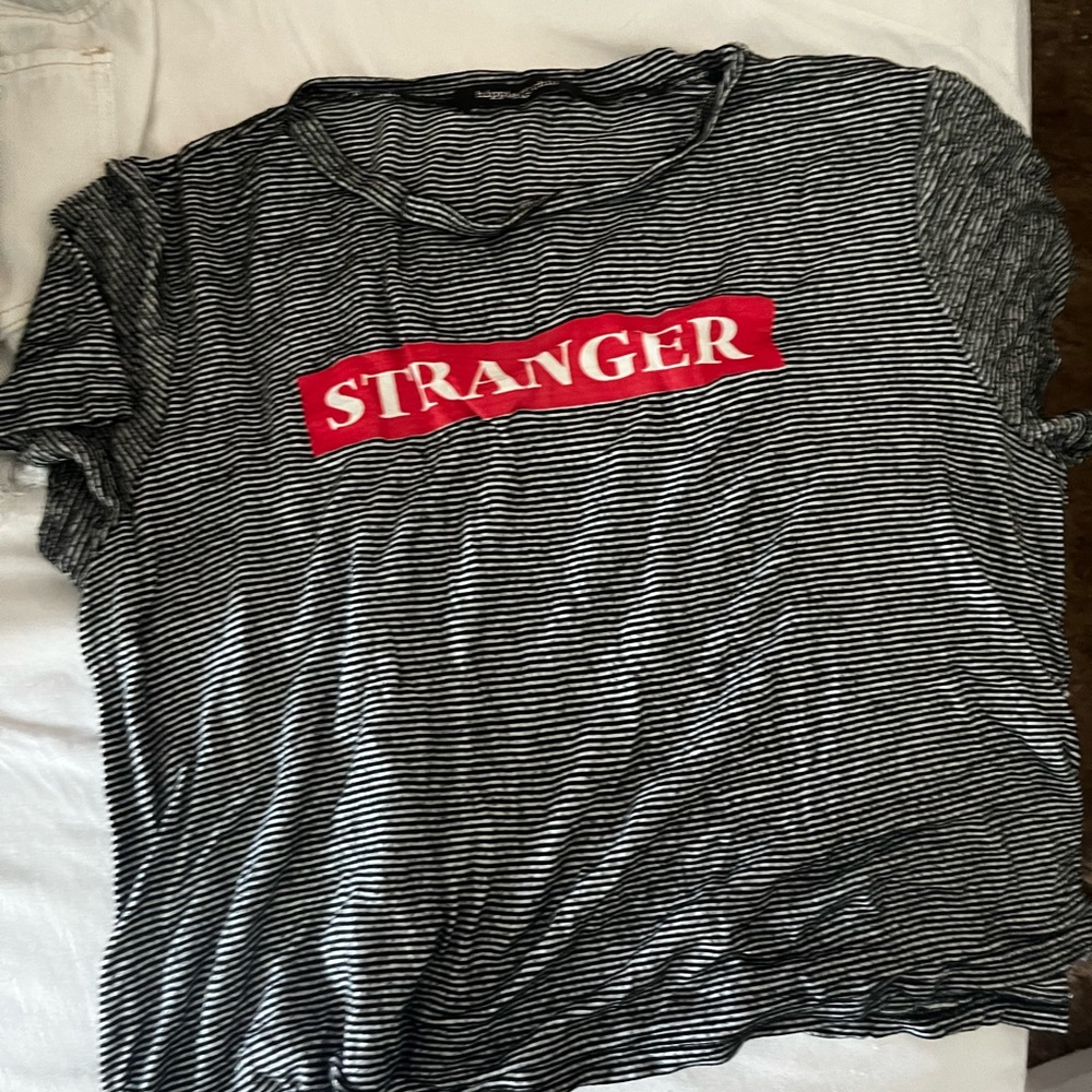 Black and white stripper crop top with graphic “stranger”